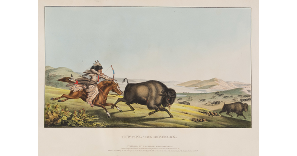 A color print of a Native American on horseback aiming his bow and arrow at a running bison.