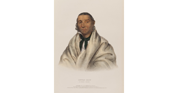 A color print portrait of an Indigenous man wrapped in a white blanket with a bandanna round his neck.