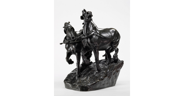 A bronze sculpture of two horses wearing harnesses running side by side.
