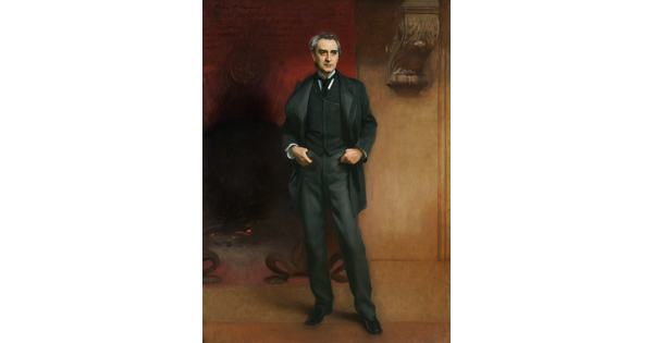 A life-size oil painting of an middle-aged White man in a dark, three-piece suit and tie, thumbs hooked into his front pockets, standing in front of a large fireplace.