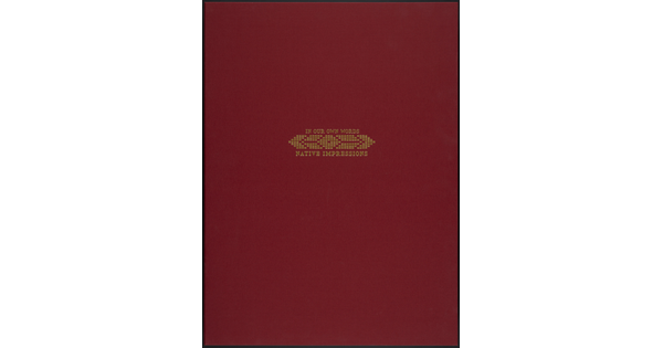 A red cloth box with the words, "In our own words, Native Impressions" stamped in gold letters.