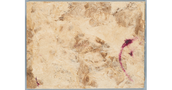 Handmade paper in neutral colors with a pink brushstroke on the right side of the paper.
