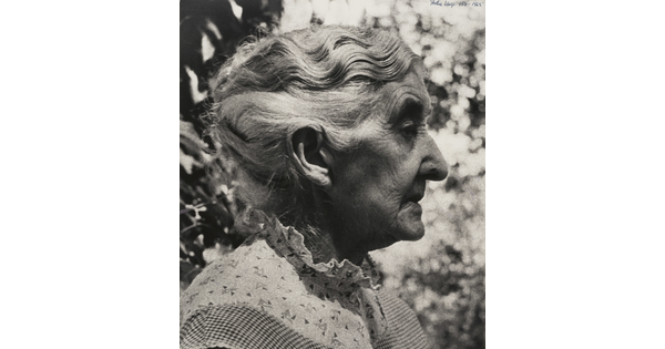 A black-and-white photograph of an elderly White woman in profile.