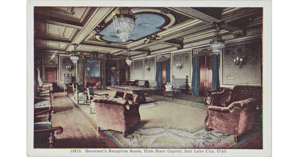 A color postcard of a richly-decorated interior space with chandeliers and velvet chairs.