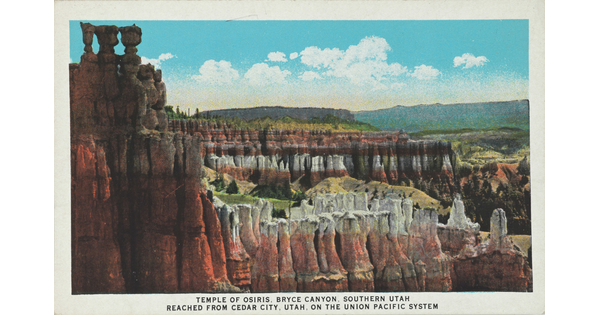 A color postcard of multicolored rocky cliffs and tall rock formations.