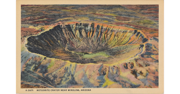 A color postcard of a bird's eye view of a large crater in a rocky desert landscape.