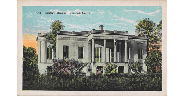 A color postcard of a white mansion with lush flowers and greenery.