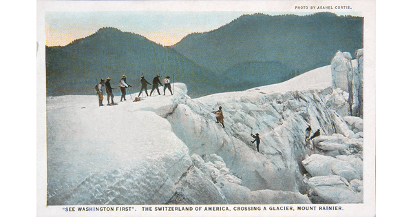 A color postcard of a group of people using ropes to climb up a glacier.