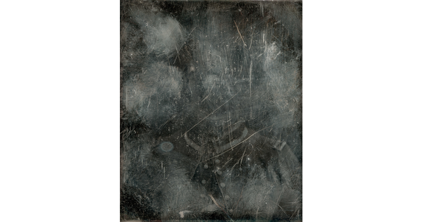 A black-and-white photograph of a man in military dress, mostly obscured by marks and scrapes on the surface.