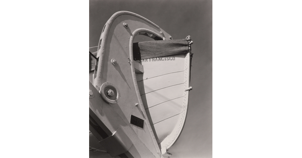A black-and-white photograph of a lifeboat stern and its mount with the words "San Francisco" painted on the hull.