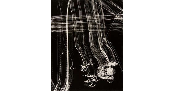 An abstract black-and-white photograph of streaks of white light intersecting at right angles across the page creating a plaid pattern.