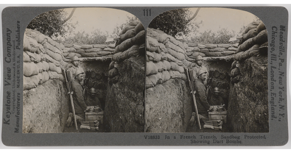 Two almost identical side-by-side black-and-white photographs of three soldiers in a trench topped by a wall of sandbags.