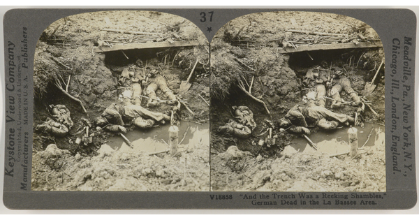 Two almost identical side-by-side black-and-white photographs of human remains in a muddy war trench.