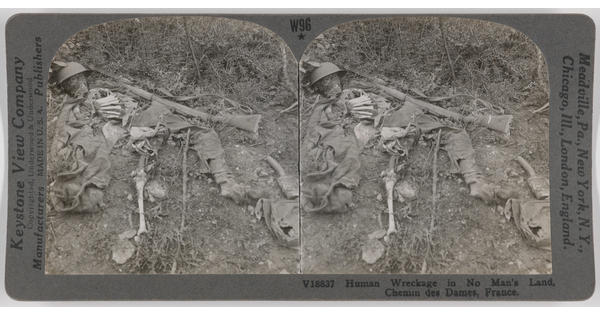 Two almost identical side-by-side black-and-white photographs of a human skeleton laying in the dirt amongst remnants of clothing and weapons.