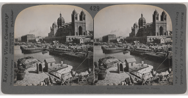 Two almost identical black-and-white photographs side by side of a large cathedral next to a river with boats docked nearby.