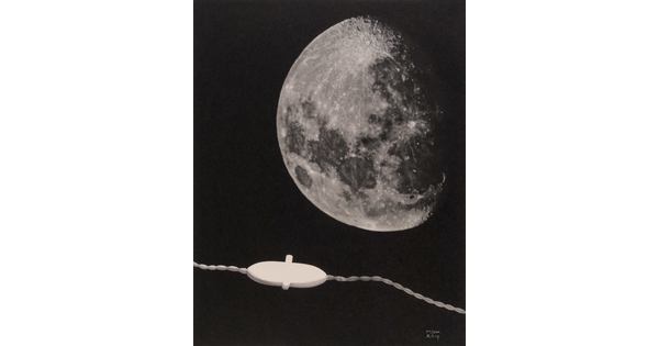 A black-and-white photograph of the moon above an electric cord with a switch.