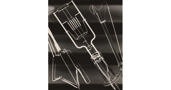 A black-and-white close-up photograph of what looks like filaments from light bulbs and other electrical devices.