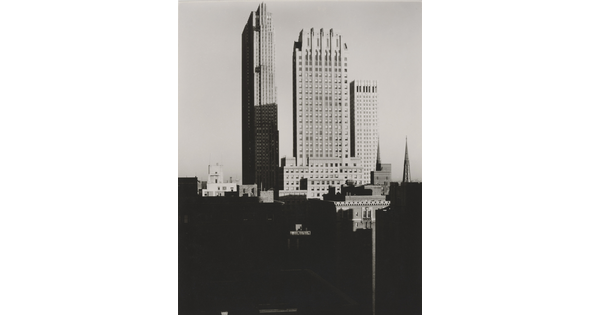 A black-and-white photograph of skyscrapers in New York City. 