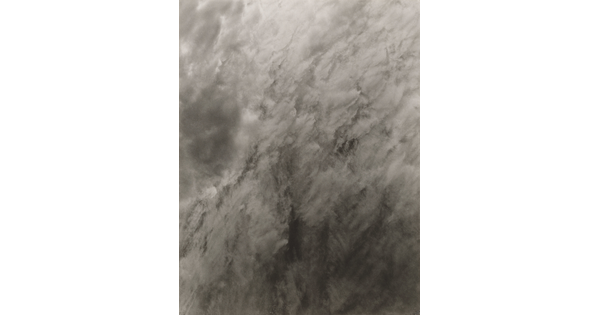A black-and-white abstract photograph of clouds or smoke.