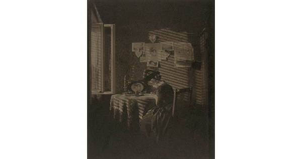 A sepia-toned photograph of a seated woman writing at a table, illuminated by light from a window.