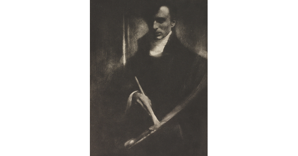 A dark, soft-focus black-and-white photograph of a White man looking down at a paintbrush and palette in his hands.