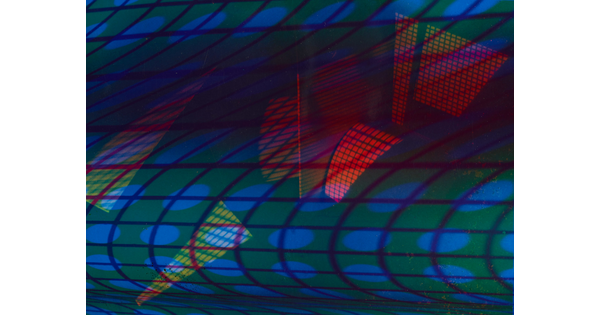 An abstract color photograph of multicolored grids of light.