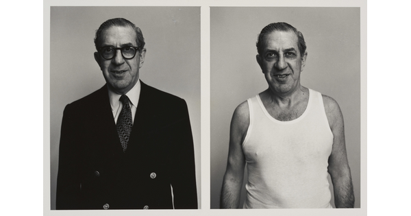 Two side-by-side black-and-white photographs of a White man in the same pose: on the left, in a nice suit and glasses, and on the right in an undershirt and no glasses.